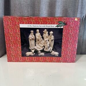 From the treasury of gifts 11 piece nativity set with wood base.